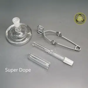 The Rogue Wax Works 14mm Quartz Cap showing the cap, bowl, tongs, and super dope stand